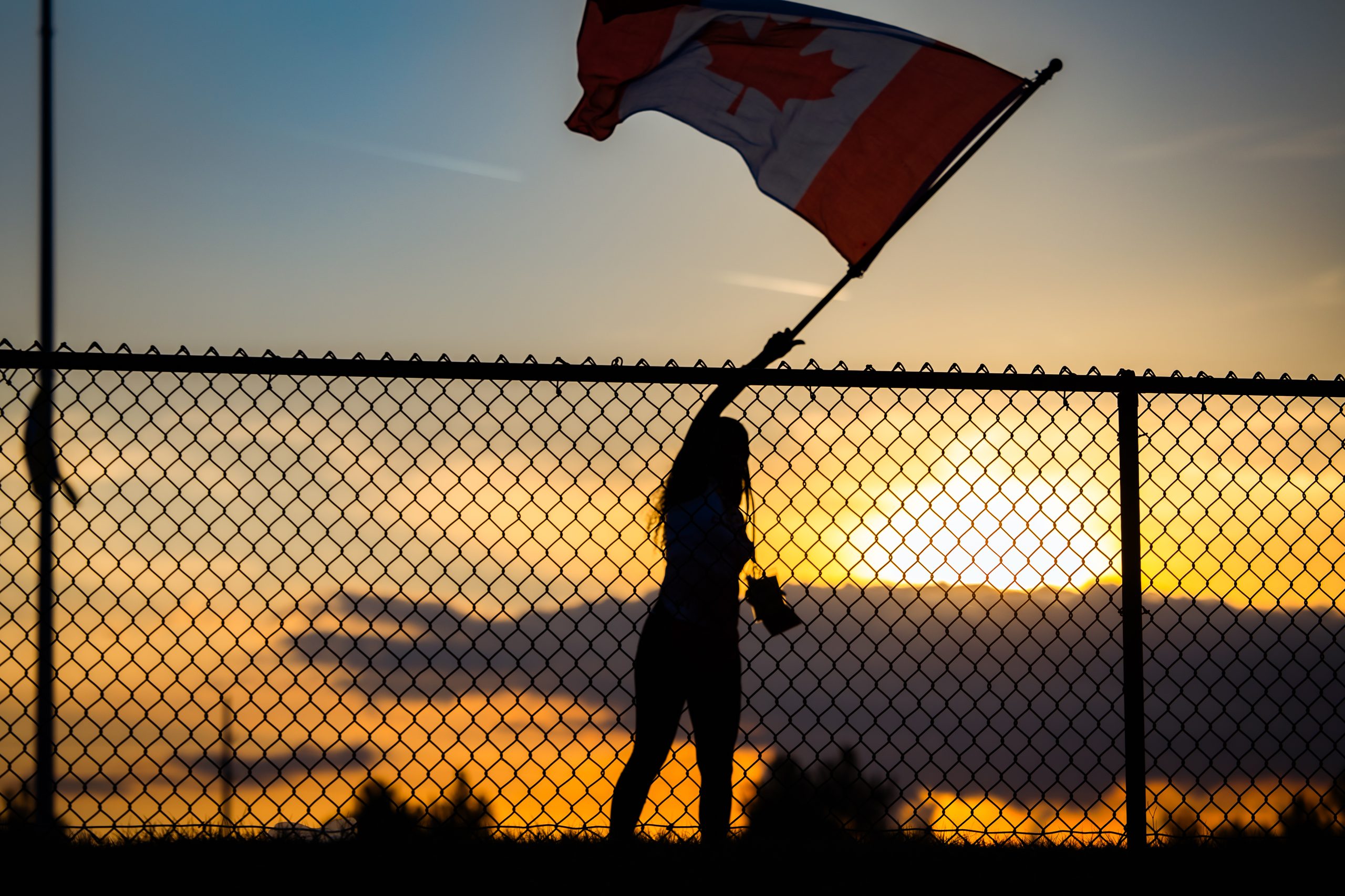 woman waving a flag at americas festival